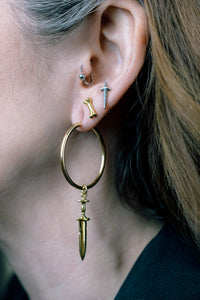 Tiny bone stud earrings, hellhound jewelry earrings, gold earrings, bone earrings, model with tiny bone studs and other hellhound earrings
