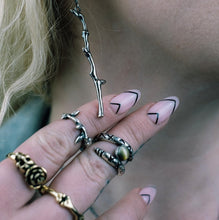 requiem ring, twig ring, sterling silver ring, hellhound jewelry ring, twig ring on hand model with other hellhound jewelry