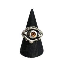 A Sterling silver evil eye protection ring with faceted citrine in the eye's center.